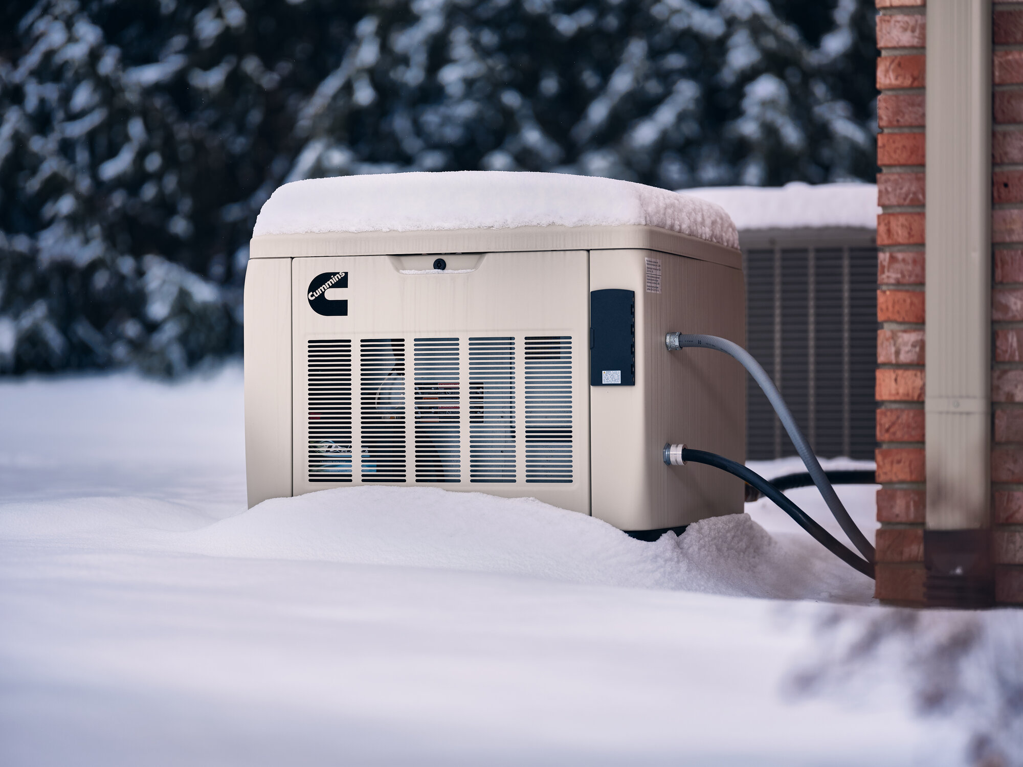Cummins air-cooled home standby generator with side panel showing internal fan-cooled engine