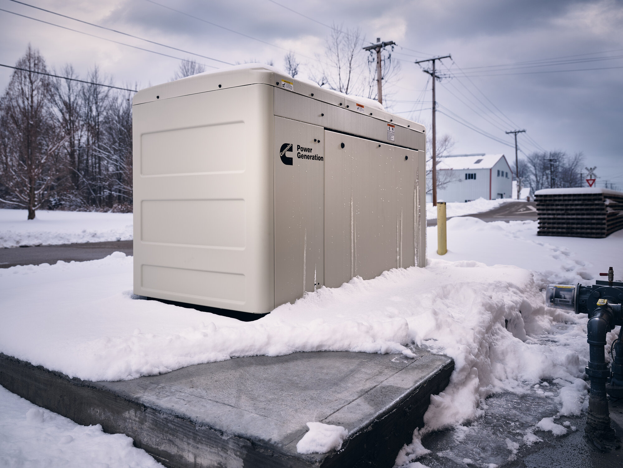 Cummins home standby generator installed on a residential concrete pad